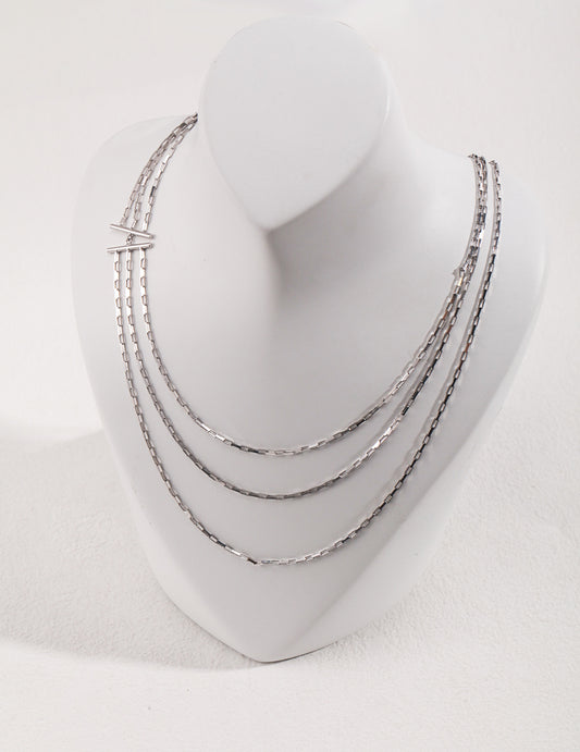 Triple Layer Silver Necklace with Modern Avant-Garde Design